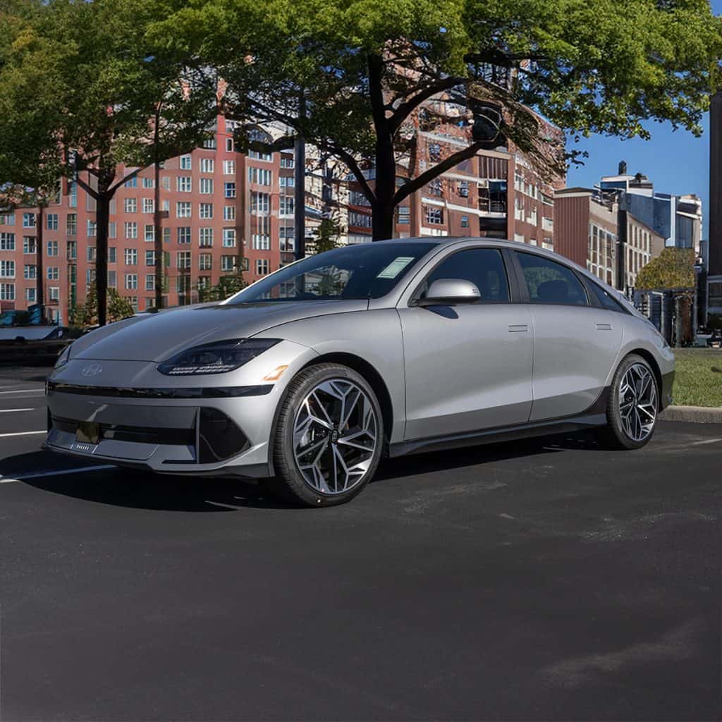 What advancements in electric vehicle battery range are projected for 2024