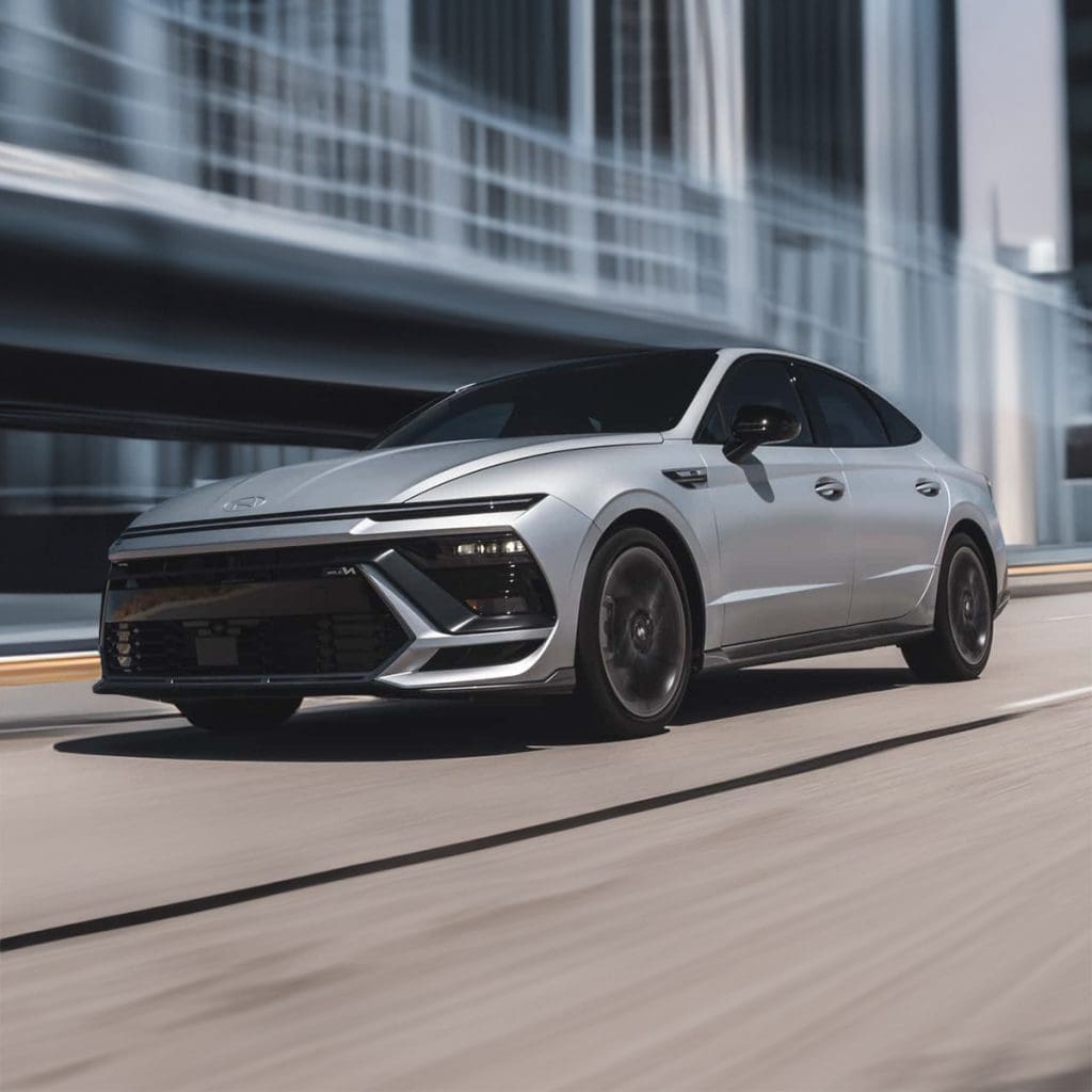 What are the environmental benefits of choosing a hybrid sedan over a conventional vehicle for the 2024-2025 period