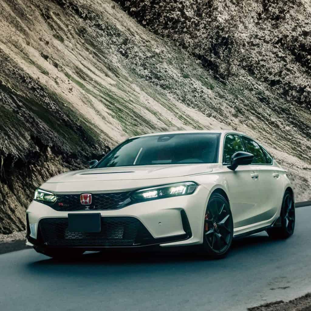 Which automakers are expected to lead in sedan safety advancements in the next two years