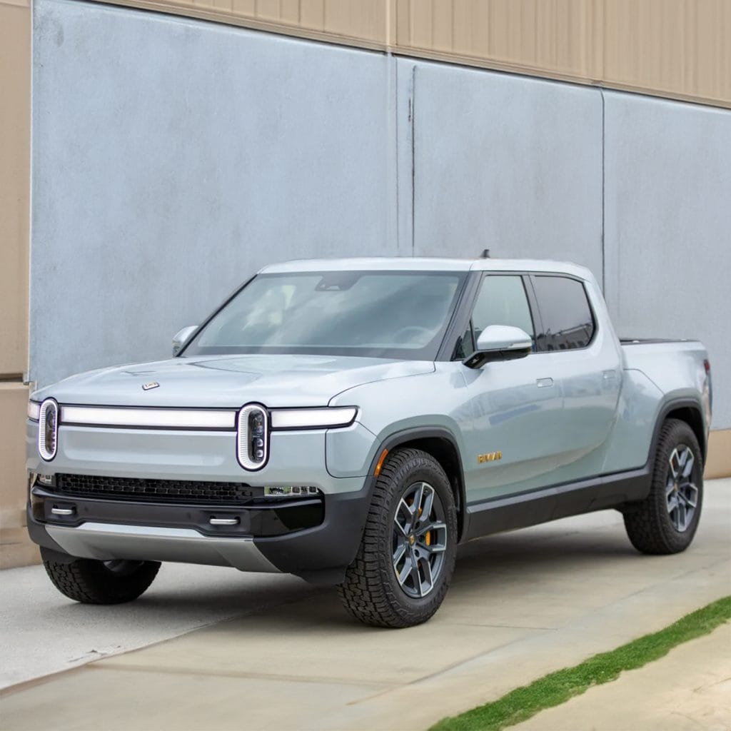 How do the upcoming Rivian electric truck models compare to their competitors